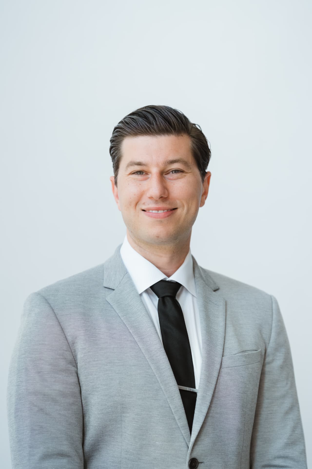 Professional portrait of Alex Hughes, lead agent with North Pacific Homes Group
